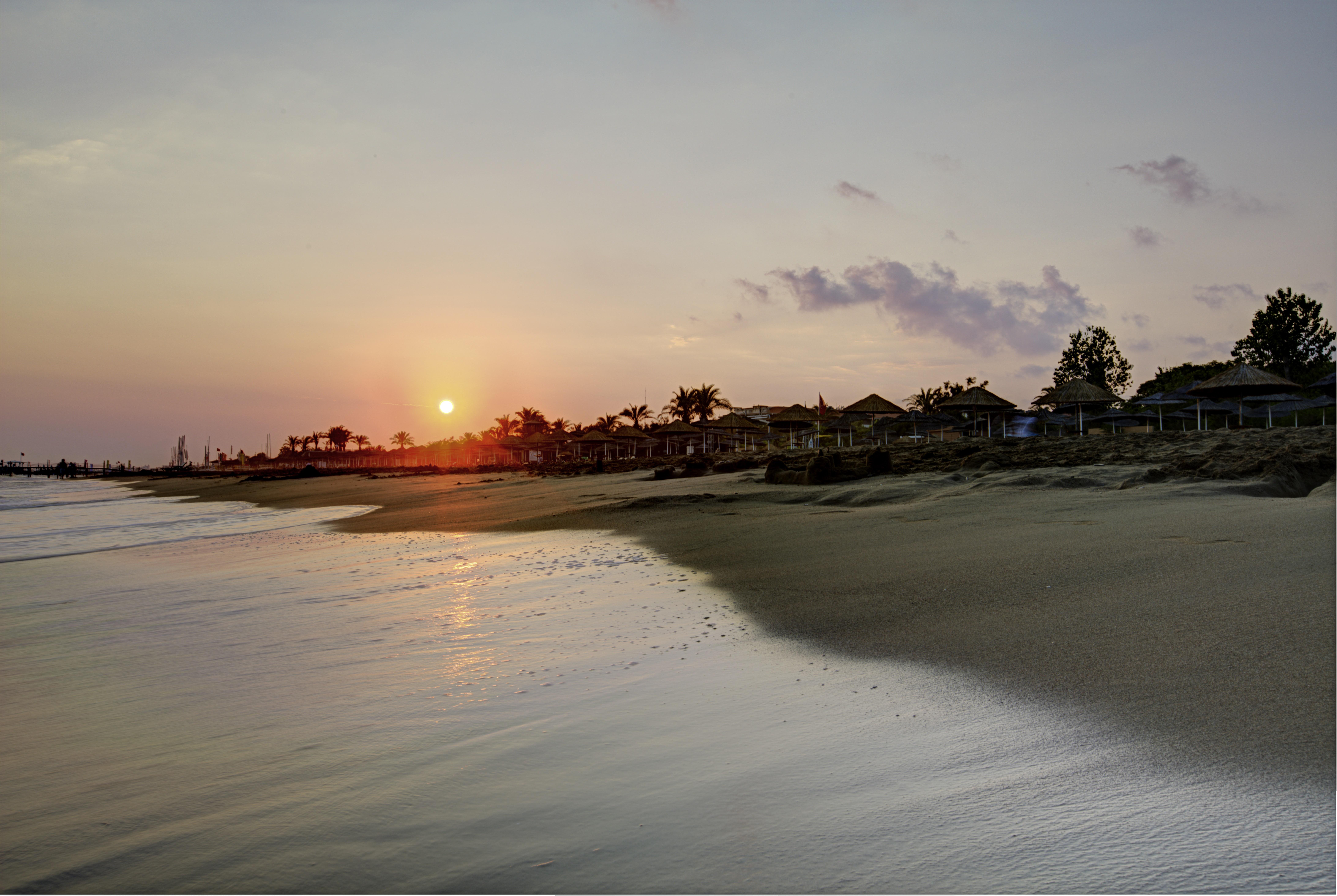 Asteria Family Resort Belek アンタルヤ エクステリア 写真 Sunset at the beach
